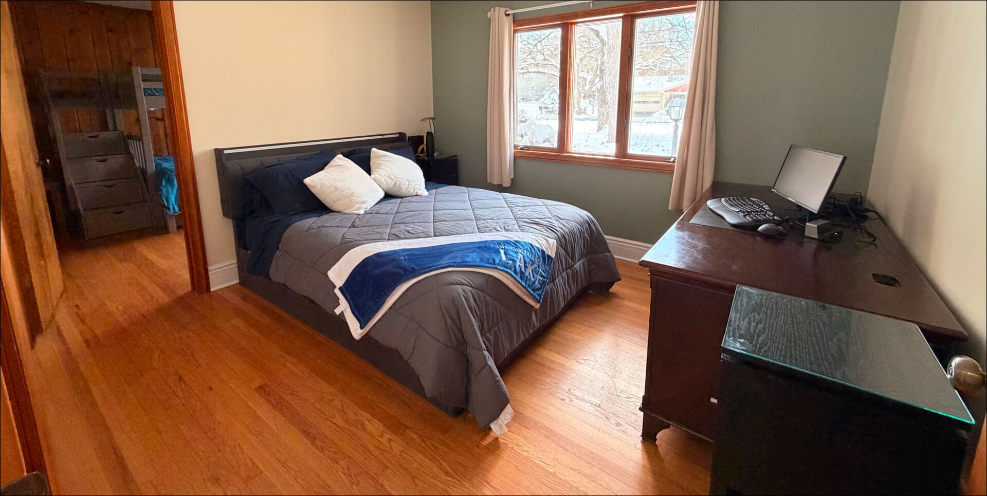 Queen Bedroom with adjoining bunk bedroom in the background